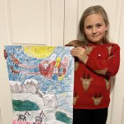 Evie is pictured with her winning design