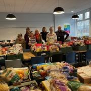 Volunteers pack the food parcels