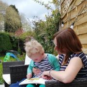 Sue O'Leary-Hall reading with her daughter Rose