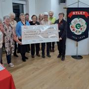 Otley Townswomen's Guild present a cheque to Yorkshire Air Ambulance