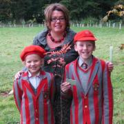 Ghyll Royd pupils Daisy Laxton, eight, left, and Harry Burns, nine, with headteacher, Jo Jenkinson, and one of the 200 new trees planted at their school