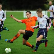 Otley Town's Harry Leigh (orange shirt) worked hard to keep Newsome's pacy attack at bay