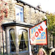Sam Makin and her house in Addingham which can be won by answering a question with a £99 ticket.