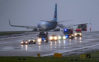 Emergency services at the scene after a passenger plane came off the runway at Leeds Bradford Airport while landing in windy conditions during Storm Babet earlier this year