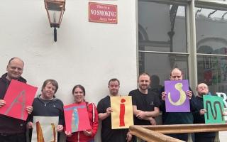 Members of the Outside the Box print group celebrate Autism Acceptance Week 2024