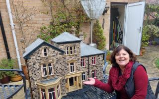 Ceri Carter with the model of the Sue Ryder Wheatfields Hospice