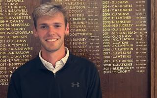 Max Berrisford pictured next to the 'Club Scratch' leaderboard at Ilkley Golf Club